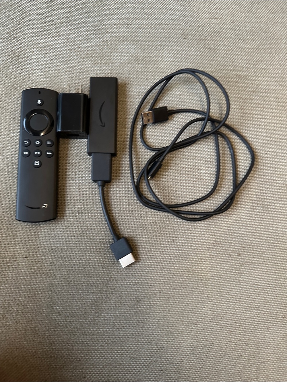 Amazon Fire TV Stick with Black Remote and Cables